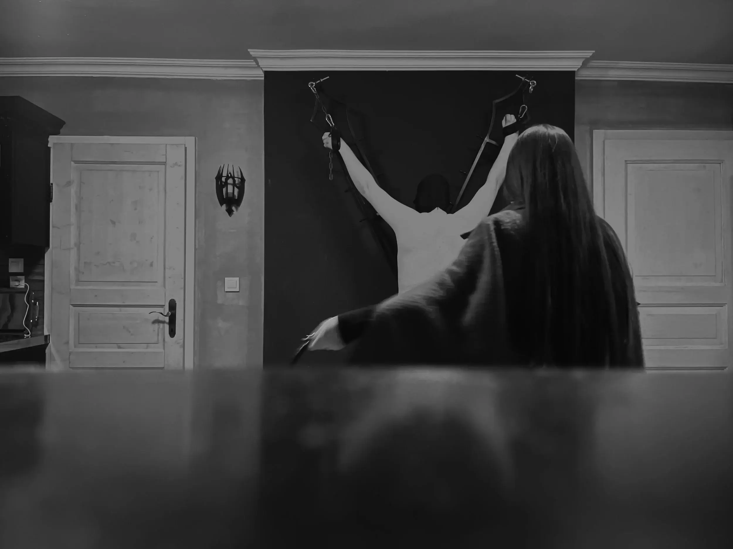 Andrew's cross in a dungeon with a slave and a dominatrix